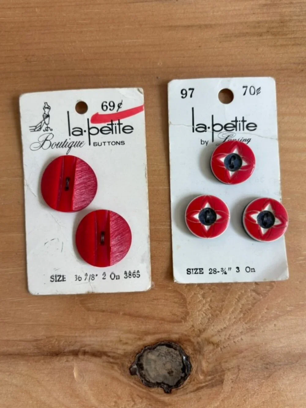 Lot of 2 NOS Vintage La Petite Boutique Red buttons on their original packaging.
